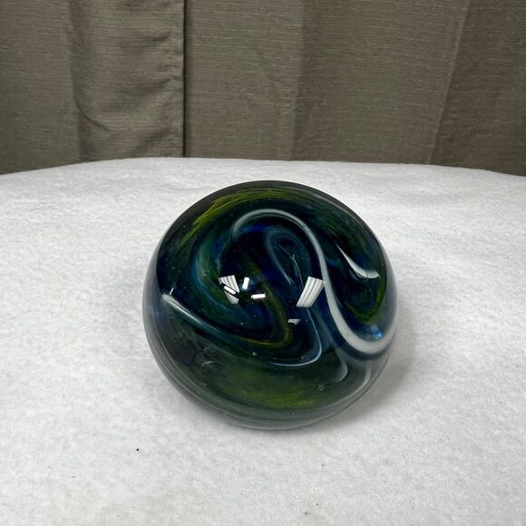 Clear glass round paperweight with blue and green swirls - Picture 5 of 7